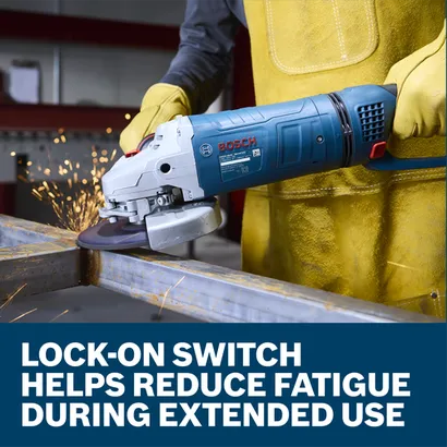 The worker using the Bosch GWS25-180JR 7 In. Large Angle Grinder to grind the edge of a piece of metal in a work shop.