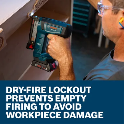 The worker using the Bosch GNH18V-35N 18V Brushless 23 Gauge Pin Nailer to nail pieces of wood.