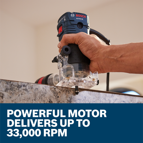 The worker using the Bosch GLF55-25 1/4 In. Laminate Trim Router in a woodworking application.
