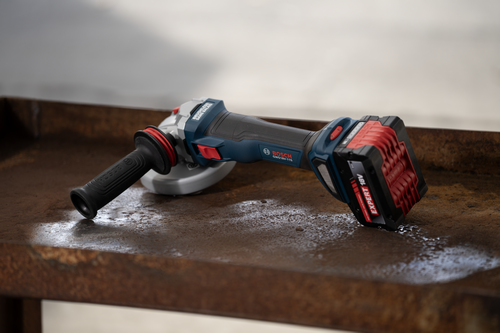 Bosch GWS18V-11SN 18V Brushless 4-1/2 – 5 In. Angle Grinder with Slide Switch and with battery on a iron table.