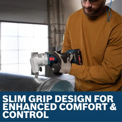 Image of worker using the Bosch GNA18V-16EN 18V 16-Gauge Nibbler to cut a metallic material.