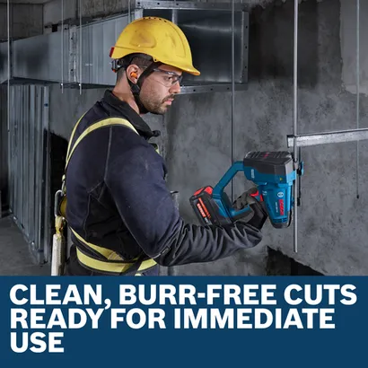 Worker using a Bosch GGC18V-12 to cut threaded rod that is inserted into a concrete wall.