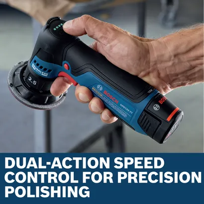 Image of worker speeding up the Bosch GPO12V-77N 12V Compact 3 In. Rotary Polisher for finishing a car.