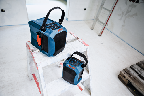 Image of Bosch GPB18V-1CN 18V Jobsite Bluetooth® Speaker on top of a ladder, in the middle of a room under renovation.