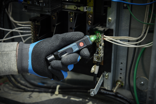 Application Image of worker using the Bosch GVD1000-15 Non-Contact Voltage Tester to check the voltage of electrical wires.