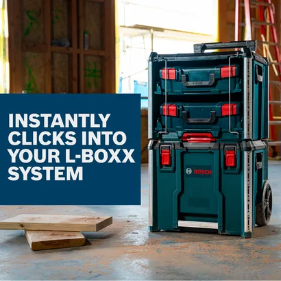 Stackable Bosch L-Boxx Contractor tool storage system on wheels in a construction site.