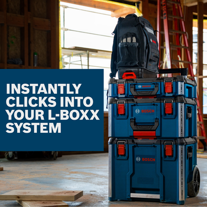 Bosch LBOXX3ST L-Boxx Contractor 3-Stack with a backpack on top in a construction site.