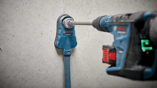 Bosch HDC200 fijado a una pared, siendo taladrado por una herramienta eléctrica.