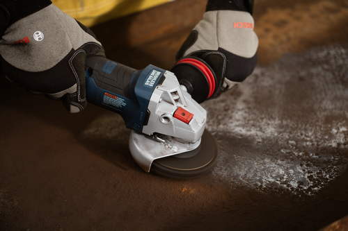 Bosch GWS18V-11PS 18V Brushless 4-1/2 – 5 In. Angle Grinder with No Lock-On Paddle Switch in use for grinding metal.