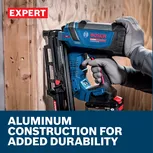 Web Image white features and worker using the Bosch 21EXTMAG 21º Ext. Magazine on a construction.